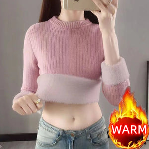 a skinny teenage girls wearing a womens fleece sweater  color light pink pastel
