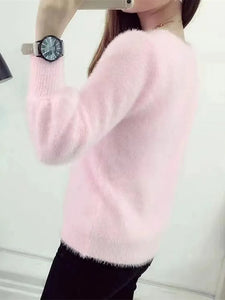 a young slim woman wearing a pink sweater fluffy side view