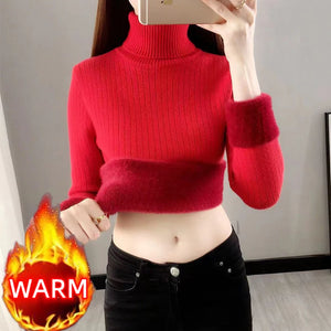 a slim woman wearing a  sweater sherpa fleece pullover red