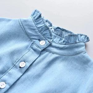 this picture is taking a closer view at the stand up collar of our Girls Denim Dress 
