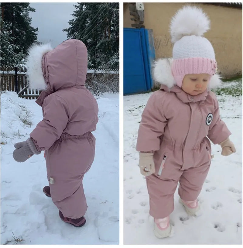 a cute 24m girl is taking a walk in snowy weather wearing Comfort Style Outdoor Wear Jumpsuit