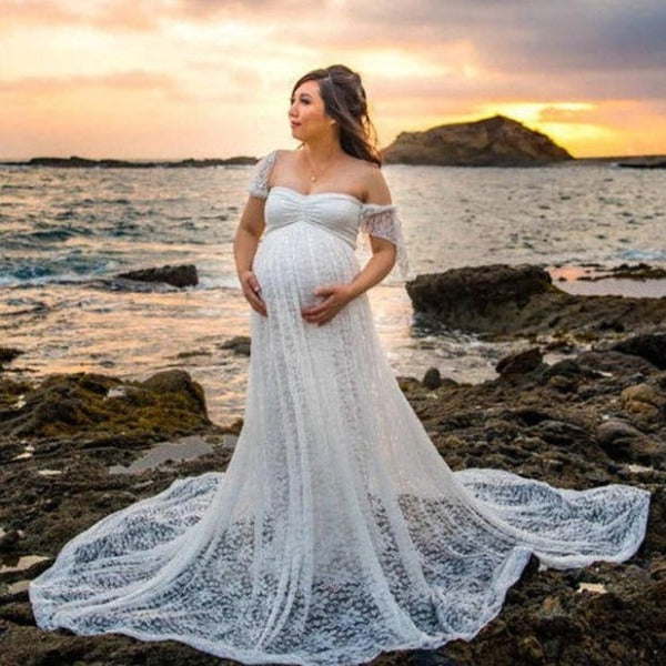 a gorgeous woman wearing a white wedding dress for pregnant