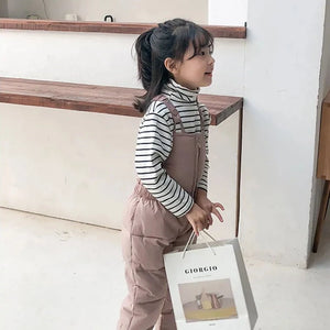 a cute 4 year old girl wearing Nylon Fabric Overalls with Cotton Insulation side view