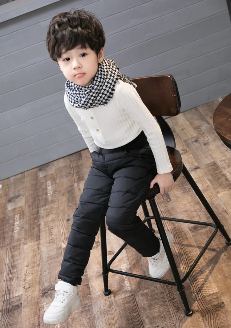 a cute y year old boy wearing Cotton Padded Trousers for Boys