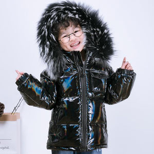 front look of a happy 7 year old boy wearing Winter Jacket For Kids color black with extra shiny finish