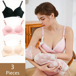 a beautiful young mom is going to nurse her baby, she's unsnapping her nursing bra using her left hand and holding her baby in her right arm. the nursing bra is sold in pack of 3, a pink, a black and a skin one.