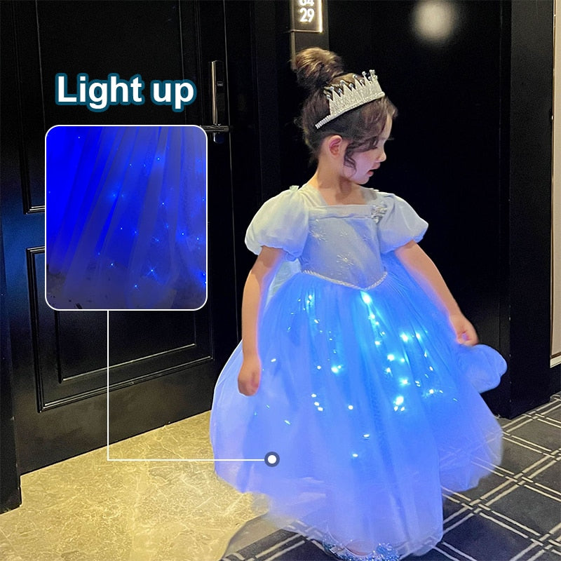 a cute 6 year old girl swirling arounf in a Light Up Princess Dress