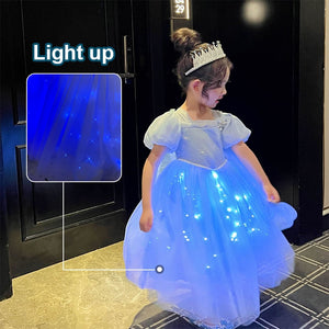 a cute 6 year old girl swirling arounf in a Light Up Princess Dress