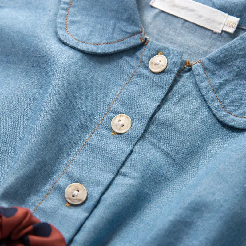 this picture is taking a closer view of rounded turn down collar and button closure of our denim shirt Dress for Girls 2-7 year old