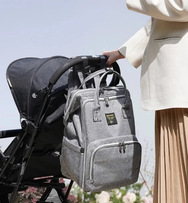 Versatile mommy backpack to carry on a stroller and keep mom's hands free