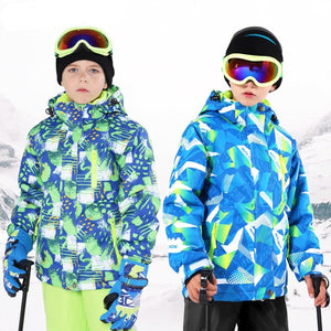 two 9 year old boys wearing ski jacket and pants sets color blue