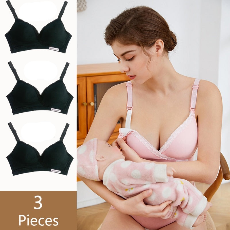 a beautiful young mom is going to nurse her baby, she's unsnapping her nursing bra using her left hand and holding her baby in her right arm. the nursing bra is sold in pack of 3, all color black