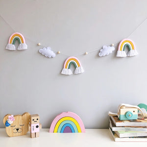 Sweet dreams guaranteed! Gentle felt stars twinkle beside a pastel rainbow, creating a whimsical nursery haven