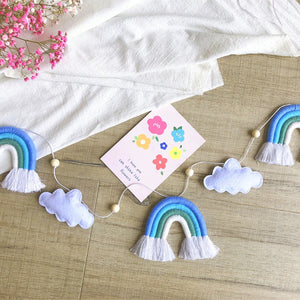 From newborn snuggles to playful giggles, this soft felt rainbow & cloud wall hanging grows with your little one.