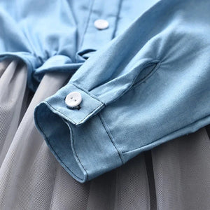 this picture is taking a closer view at the long sleeves of our Girls Denim Dress 