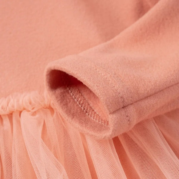 this picture is taking a closer look at long sleeve cuff of toddler girl dresses color pink