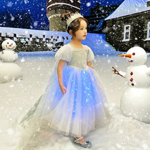 a cute 7 year old girl wearing Light Up Princess Dress for her winter party