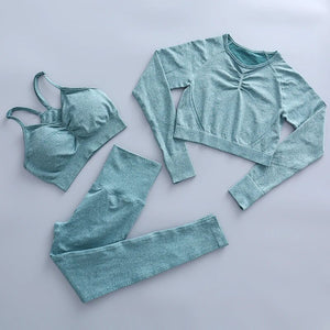 this picture is showing a color light green yoga suit set consisting of 3 tems: a pasta top with bust suppert, a long sleeve top and a pair of pants with high waist to flatten your belly and butt push up effect.