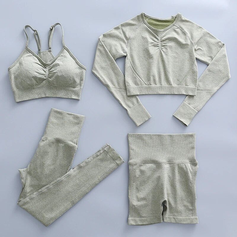 this picture is showing a light olive yoga suit set consisting of 3 tems: a pasta top with bust suppert, a long sleeve top, a pair of shorts and a pair of pants with high waist to flatten your belly and butt push up effect.