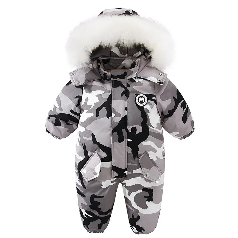this picture is presenting one piece snowsuit camo gray with white faux fur on the hood front view at white background