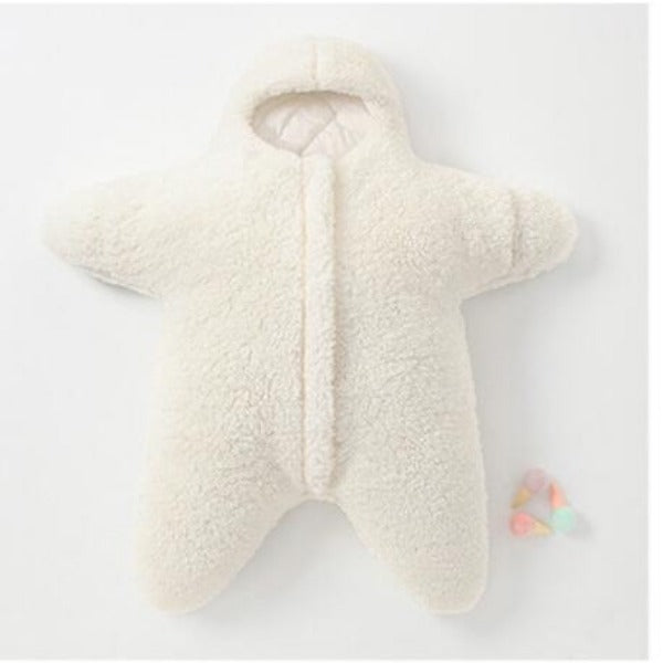 white Baby Star Costume | Winter One Piece lying flat on a white surface