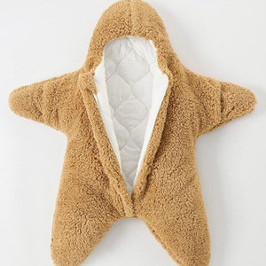 the Baby Star Costume | Winter One Piece in honey-brown color is lying flat on a white surface. the Baby Star Costume | Winter One Piece is unzipped so you can see its warm and cosy inside layer made of cotton soft to touch