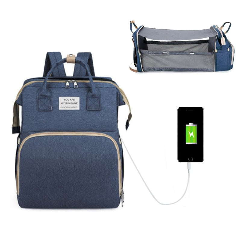 Diaper Bag Backpack with usb output transforms into a changing mat colour denim blue