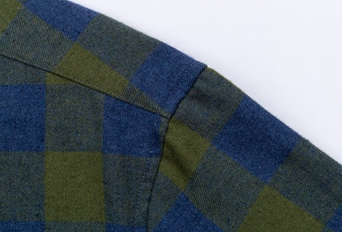 picture showing a plaid flannel shirt shoulder with reinforced seam