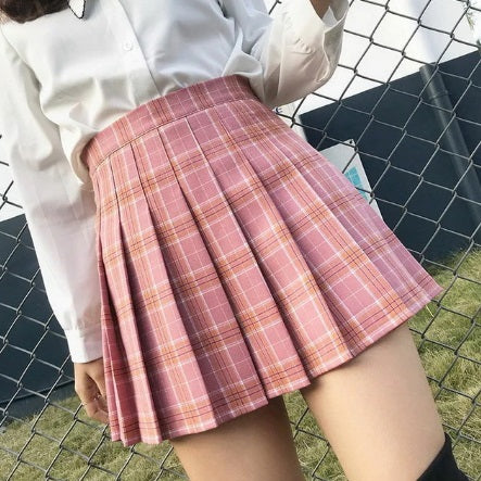pink plaid pleated mini skirt on girl wearing white shirt and thighboots