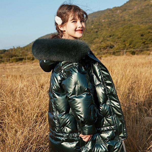 a nice 11 year old girl wearing our knee long quilted coat color emerald green 