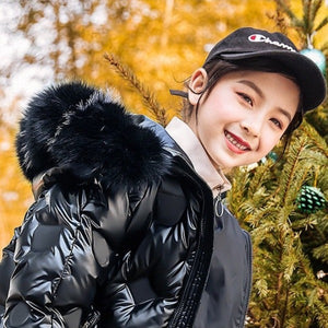 a smiling 9 year old girl wearing Down Jacket Long unzipped