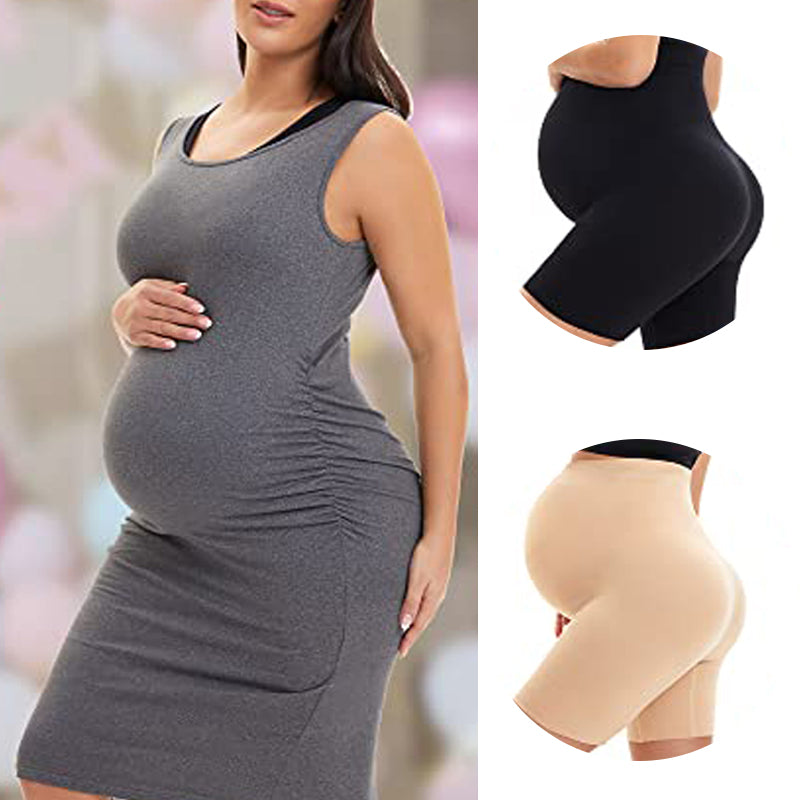 a beautiful pregnant woman wearing a slim fit dress and bodyshaping pregnancy underwear with long legs and tummy support