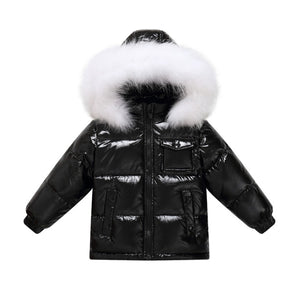 Winter Jacket For Youth color black with metallic shine and hood is decorated with real fur in color white