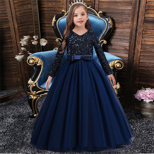 A cute 9 year old girl wearing royal blue Flower Girl Dress
