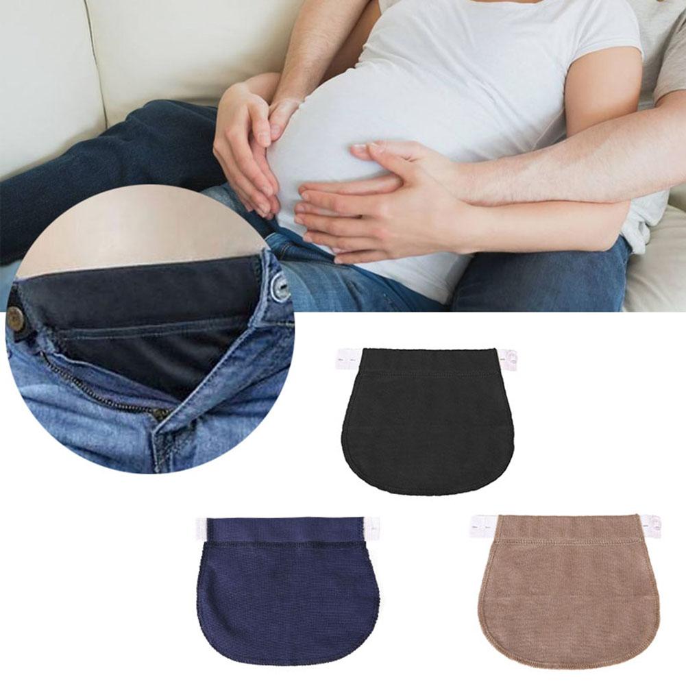 a pregnant couple enjoys their pregnancy journey in comfortable pre-pregnancy clothing extended by the means of Pregnancy Pants Lengthening Waist Extender